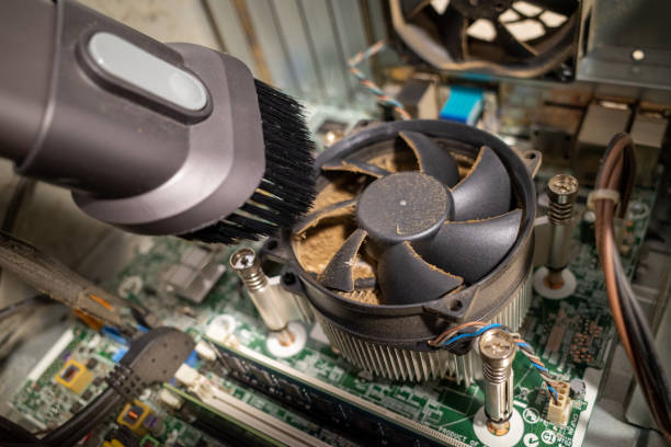 istock a very dirty computer fan inside a computer is cleaned by a vacuum cleaner 1197321850