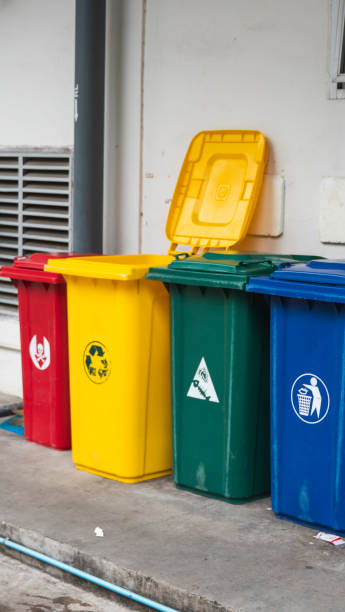 istock Garbage Trash Bins for collecting a recycle materials. Garbage trash bins for waste segregation. Separate waste collection food waste, plastic, paper and danger waste. Recycling. Environment. 1197324212