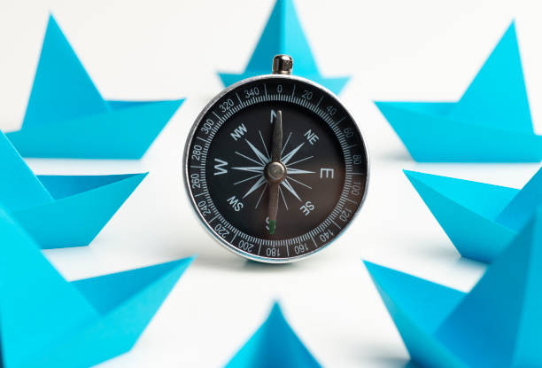 istock Blue Paper Boats With Compass 1197325357