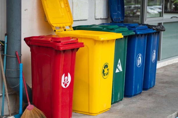 istock Garbage Trash Bins for collecting a recycle materials. Garbage trash bins for waste segregation. Separate waste collection food waste, plastic, paper and danger waste. Recycling. Environment. 1197326087