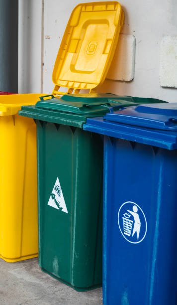 istock Garbage Trash Bins for collecting a recycle materials. Garbage trash bins for waste segregation. Separate waste collection food waste, plastic, paper and danger waste. Recycling. Environment. 1197327495