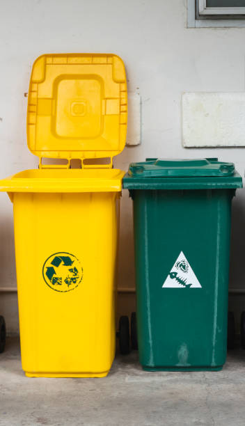 istock Garbage Trash Bins for collecting a recycle materials. Garbage trash bins for waste segregation. Separate waste collection food waste, plastic, paper and danger waste. Recycling. Environment. 1197328430