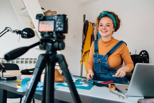 istock Shoemaker filming a video blog about her craft 1197337662