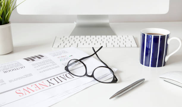 istock newspaper with news on white background 1197338237