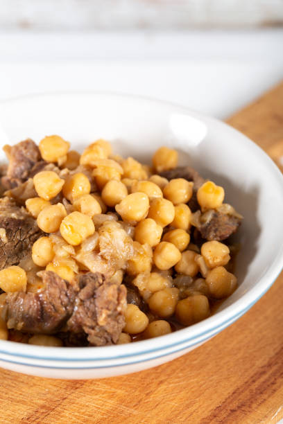 istock Chickpea stew dish on wooden board 1197338328