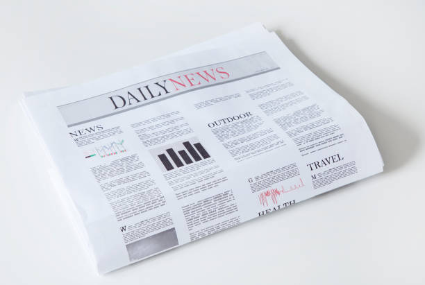 istock newspaper with news on white background 1197338394