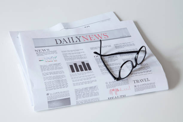 istock newspaper with news on white background 1197338458