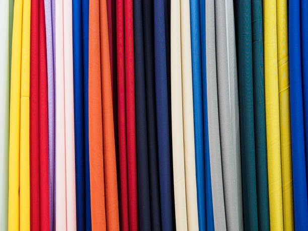 istock Multi-color knitted fabric samples in vertical position. Woven texture and background 1197339848