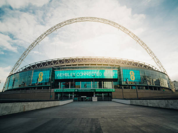 London, UK - October 22, 2018: supporters of Tottenham Hotspur FC walking on Wembley Way outside Wembley Stadium before a match in the Premier League, the top division in English football. Room for copy space.