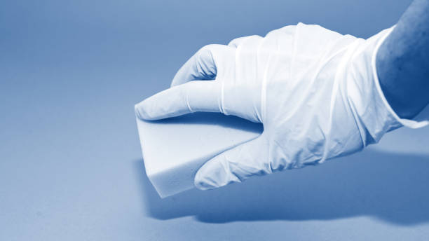 Melamine sponges on classic blue background