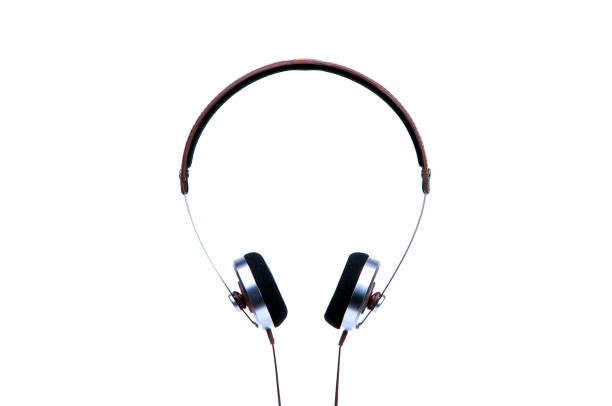 istock Silver headphones with cable isolated on white background. 1197345215