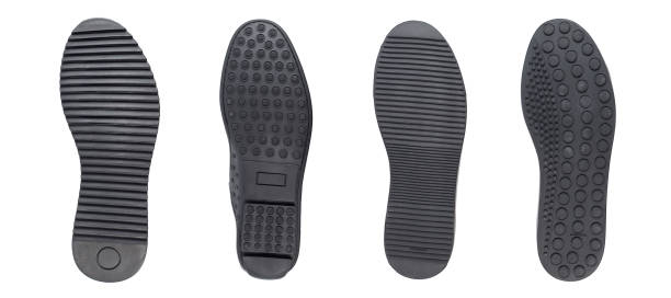 istock Four black shoe sole in row. Whole background. 1197345981