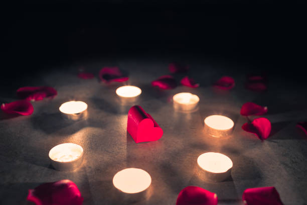 istock Heart surrounded by candles and rose petals. 1197346365