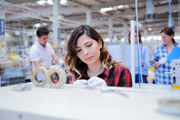 istock Group of workers working on the production line in factory 1197346646