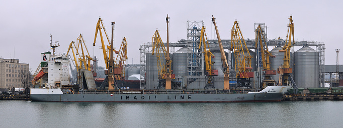 General cargo ship AL-MOTHANNA IMO 9649976 of IRAQI LINE shipping company at the berth of grain terminal in port of Odessa. December 11, 2019