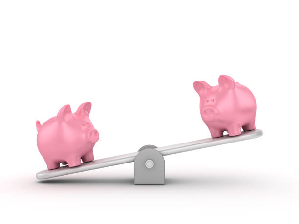 istock Seesaw Scale with Piggy Banks - 3D Rendering 1197364201