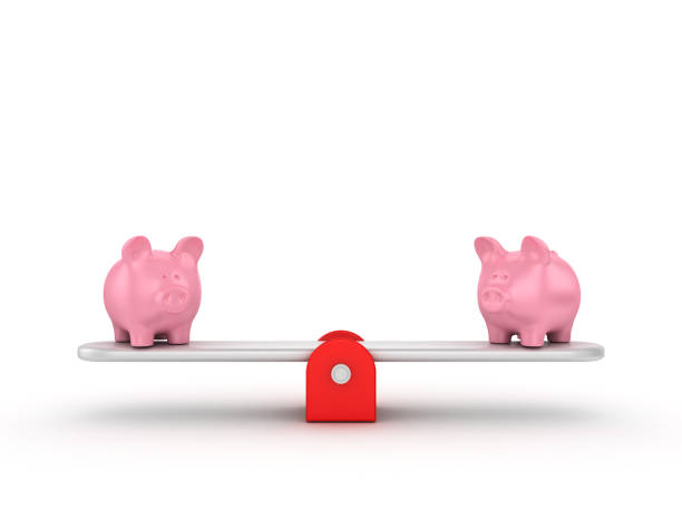 istock Seesaw Scale with Piggy Bank - 3D Rendering 1197364573