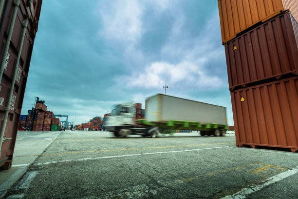 istock Blurred Shot of Truck Driving Through Container Terminal 1197366681