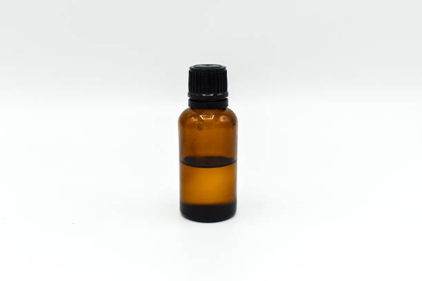 istock Glass bottle of tea tree oil isolated on white background 1197367576