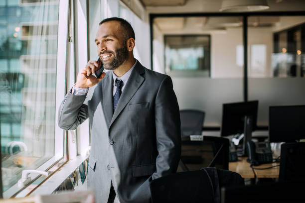 istock Businessman in office talking on the mobile phone 1197368629