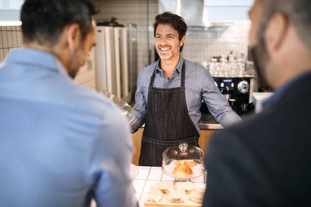 istock Two businessman in coffee shop 1197368698