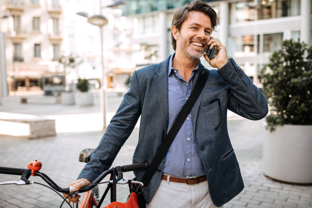 istock Businessmen arriving at work with bicycle 1197368700