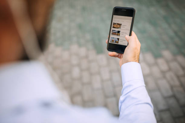 istock Businessman using his smart phone to order food 1197368709