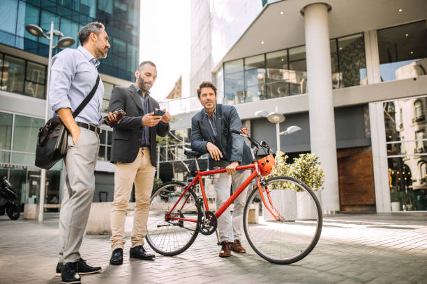 istock Business people in front of business building on break after work 1197368712