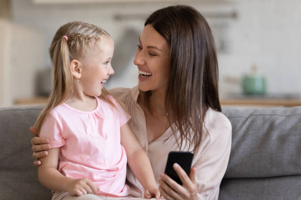 istock Laughing 30s mother making selfie together with daughter. 1197373093