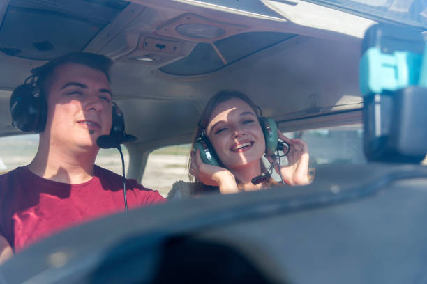 istock A beautiful, young business lady and her personal pilot. 1197373360