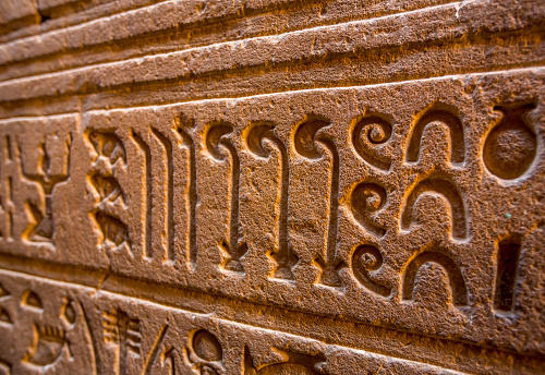 Closeup of Sanskrit language script on stone wall of world heritage site Ahilayabai temple, Maheshwar, Madhya Pradesh, India, Asia
