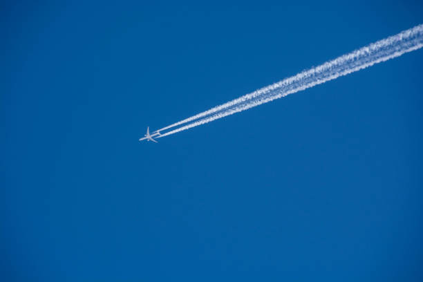 istock Contrail in the blue sky in winter 1197383637