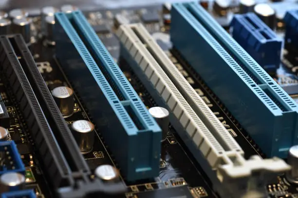 Photo of Motherboard with blue PCI-express slot, close-up and selective focusing