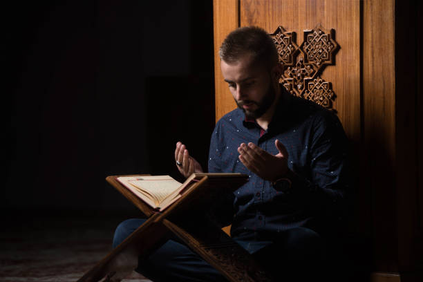 istock Muslim Man Is Reading The Koran 1197387231