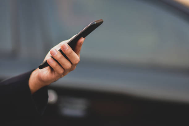 istock Business people holding cell phone or mobile smart phone technology communication 1197394223