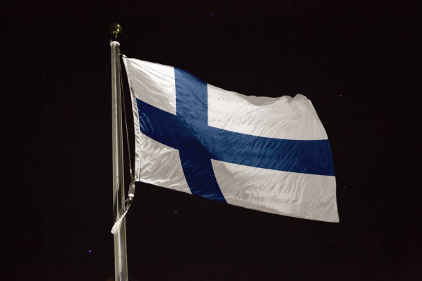 istock Finland flag blowing in the wind at night 1197396358