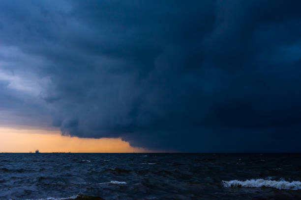 istock Approaching storm cloud with rain over the sea. 1197401196