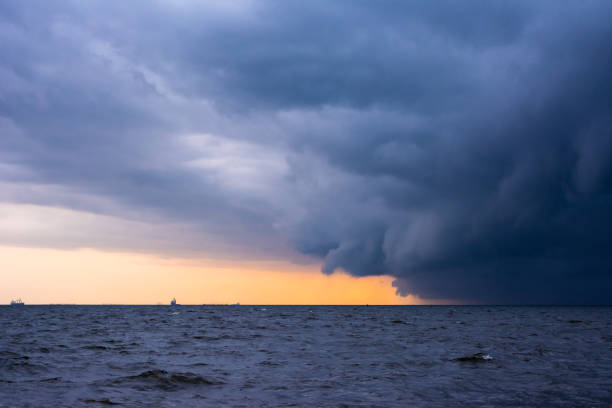 istock Approaching storm cloud with rain over the sea. 1197401215