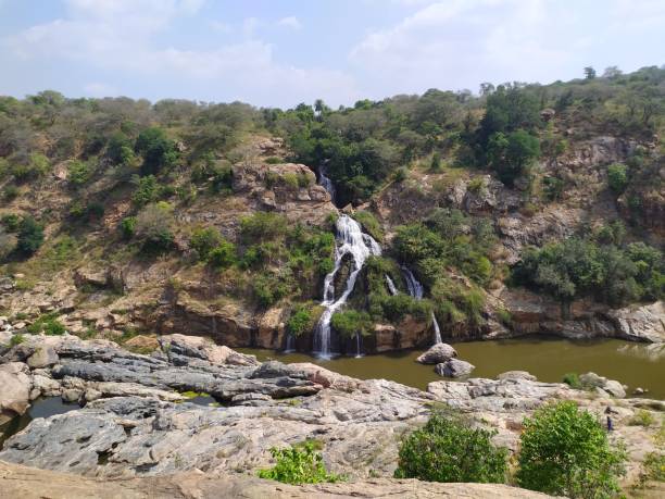 istock Water fall and pond on hill station with full greenery 1197402911