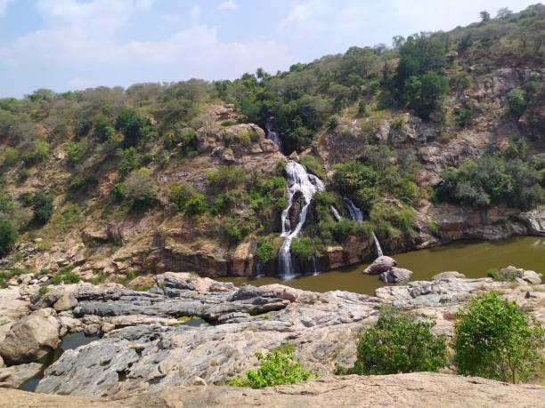 istock Water fall and pond on hill station with full greenery 1197402923