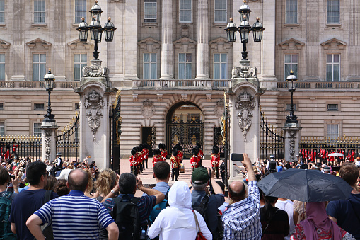 Buckingham Palace, a tourist attraction in London. Lots of tourists to watch the Changing of the Guard ceremony./ Buckingham Palace, London, UK/ 07-10-2017