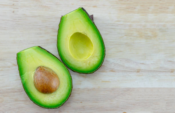 istock fresh avocado on wood block texture background 1197409325