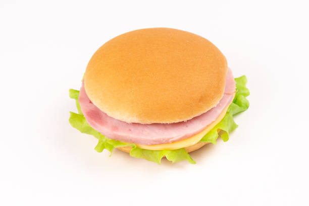 Sandwich with ham, cheese, lettuce on white background. Space for text or design.