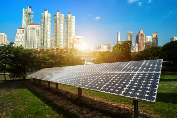 istock Solar panel with modern urban construction and skyscrapers background.Alternative energy concept,Clean energy,Green energy. 1197415034