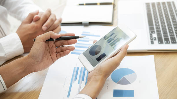 istock Business team brainstorming and discussing with financial data and report graph. Teamwork meeting working concept. 1197415847