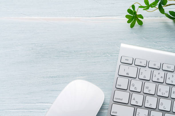 istock Office desk with copy space. Isolated computer keyboard (and mouse) on wooden background. 1197418444