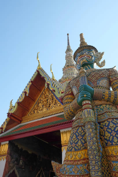 istock Patterned sculpture of a demonic warrior near a Buddhist temple. 1197419340