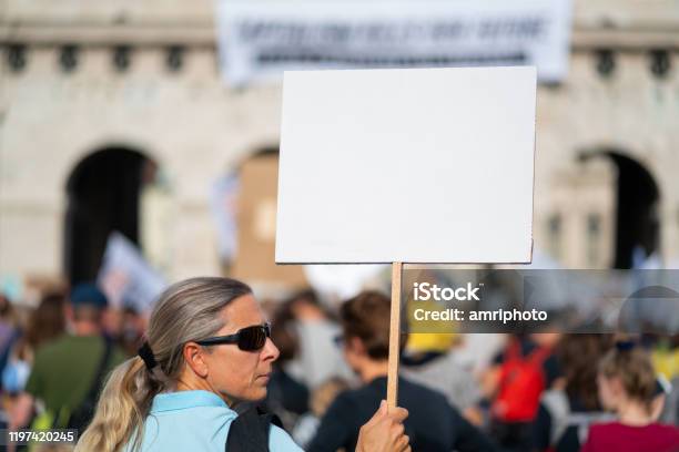 Climate Activist With White Sign At Fridays For Future Demonstration Stock Photo - Download Image Now
