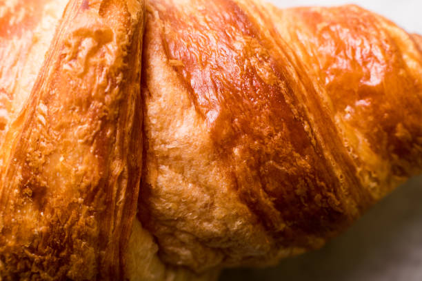 Croissant with almonds on a marble background