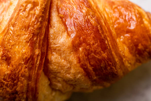 Croissant with almonds on a marble background